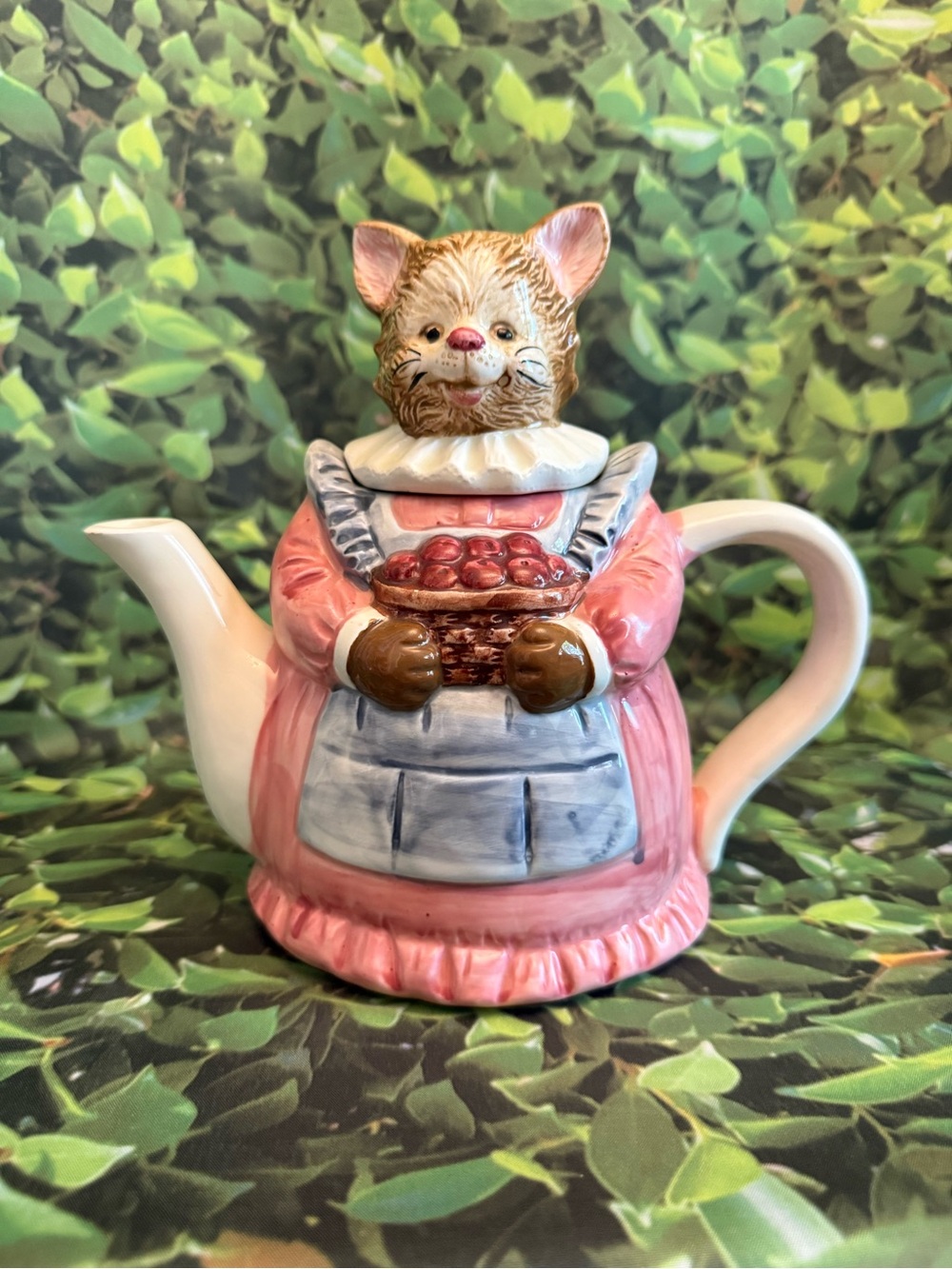 Ceramic Cat Teapot Holding Basket of Apples in Pink and Blue